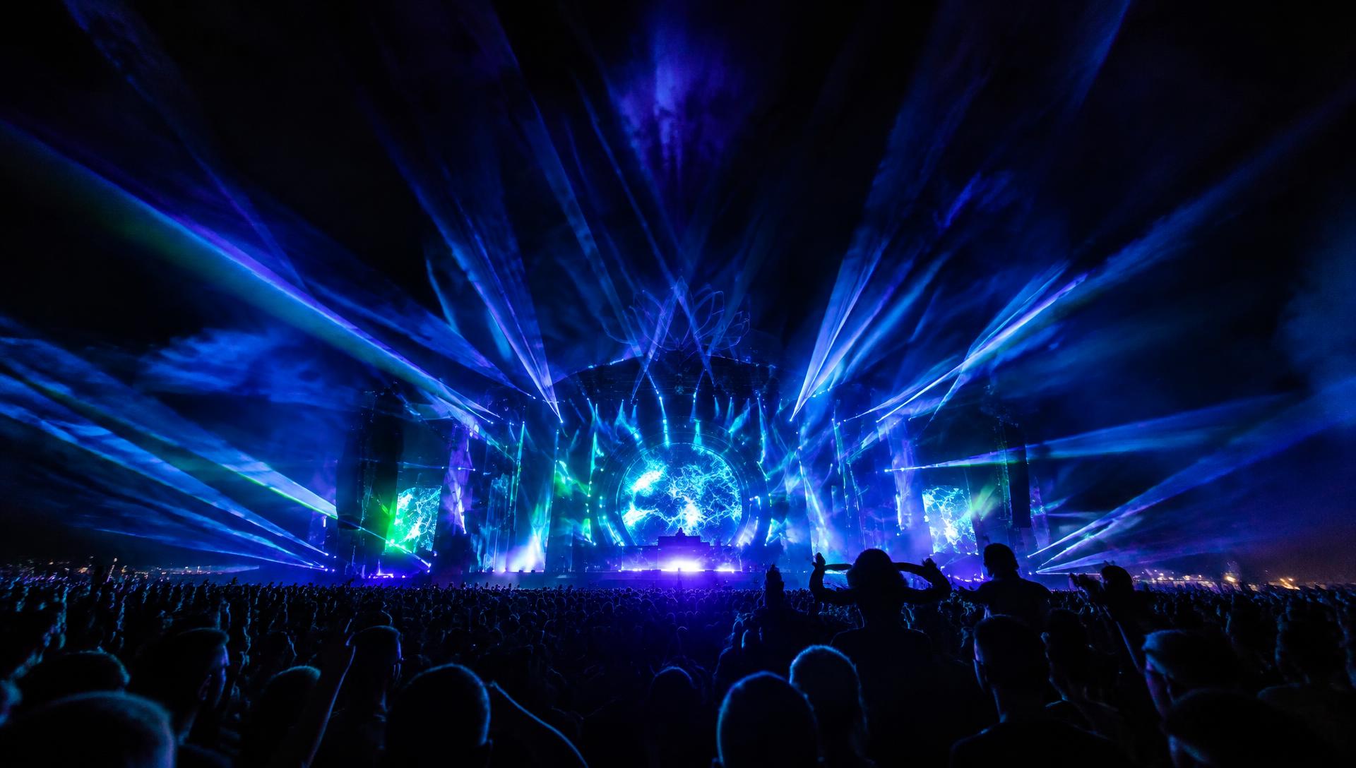 Laser beams over a festival crowd